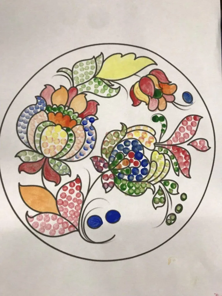 A Petrykivka folk painting in the dot technique — flowers in a circular design.