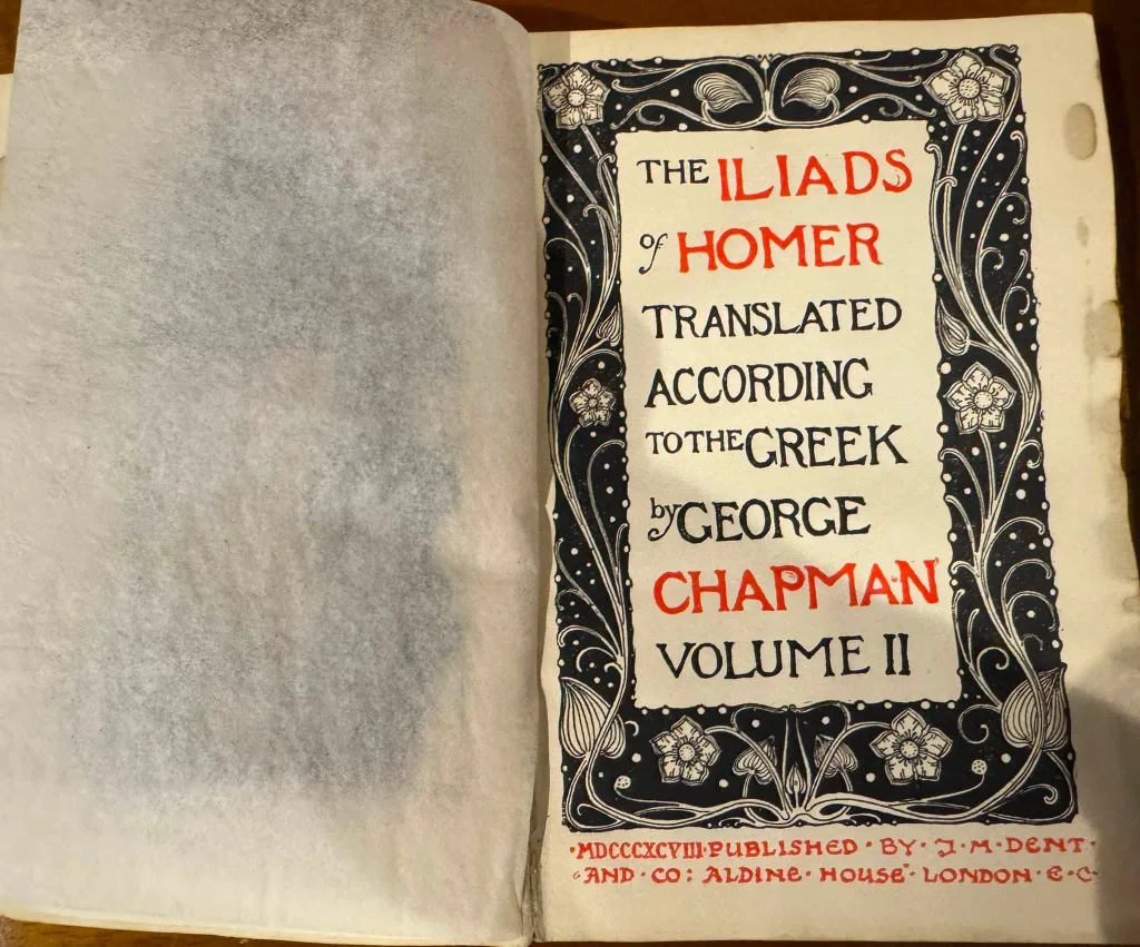 Volume II of the same Chapman translation of the Iliads of Homer, open at its title page.